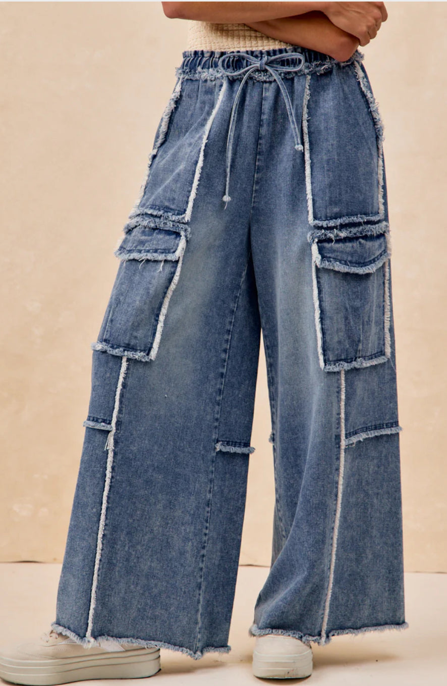 WASHED DENIM PANTS WITH DISTRESSED SEAM DETAILS