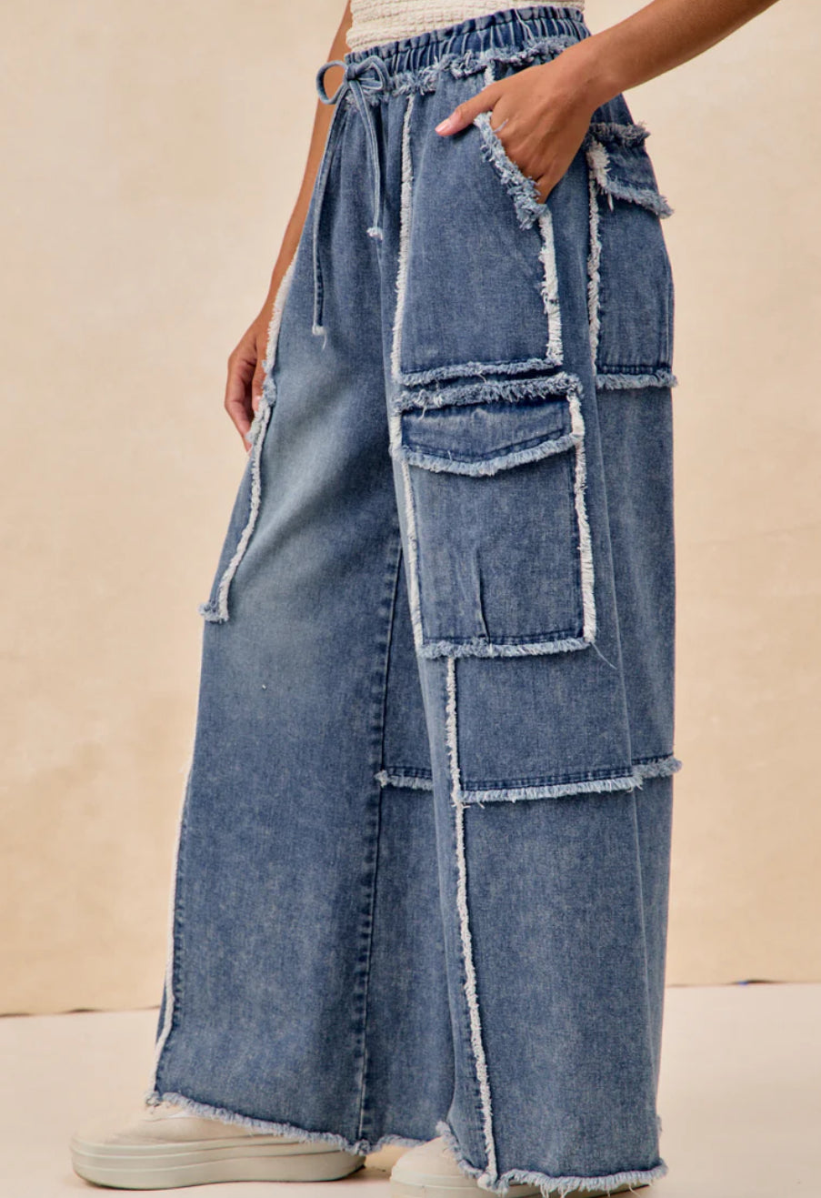 WASHED DENIM PANTS WITH DISTRESSED SEAM DETAILS